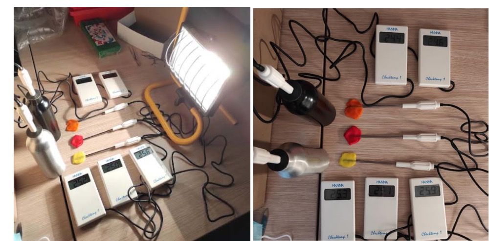 Materials of different colors placed under a lamp to compare their albedo and resulting temperature rise